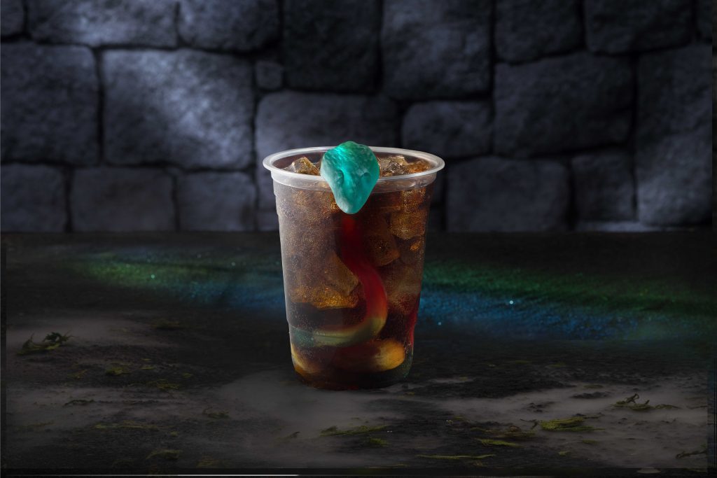 alcoholic drink with snake gummy