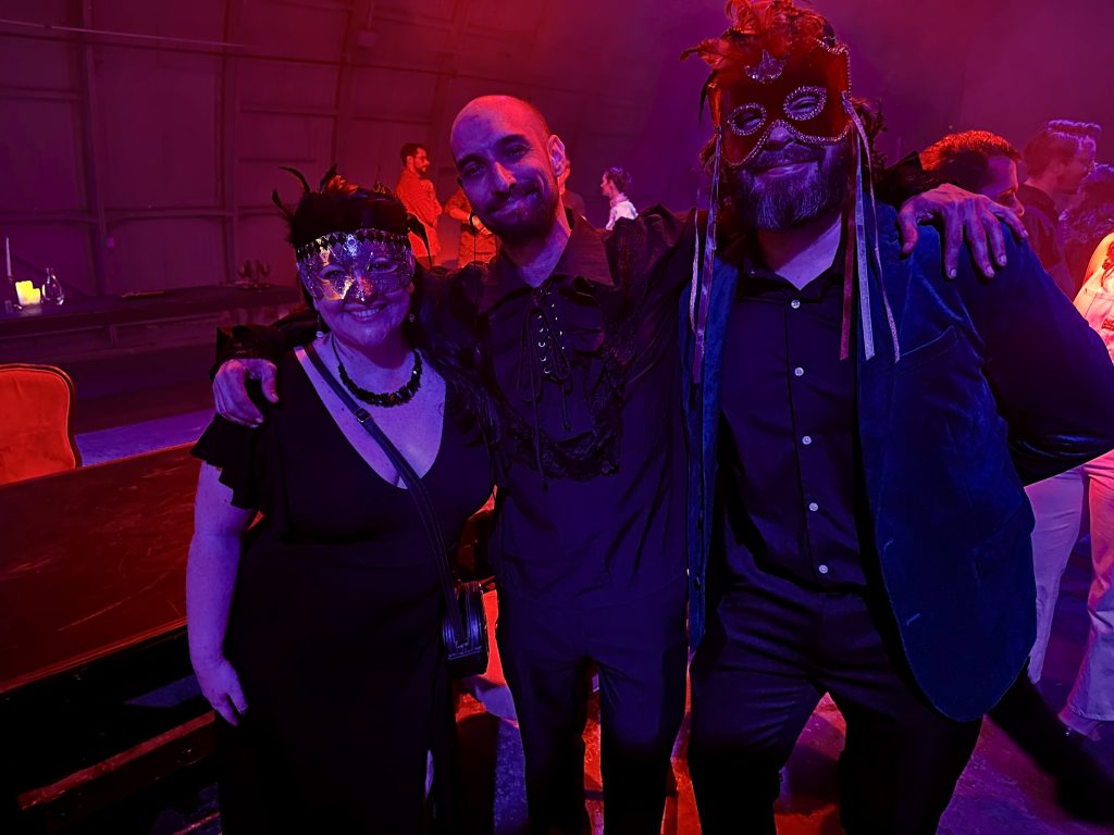 attendees dressed in masquerade attire
