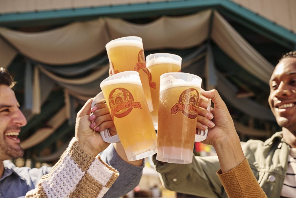 guests cheers with beer steins